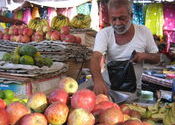 Fruit vendor by Shajara.  Tags: People and Faces.