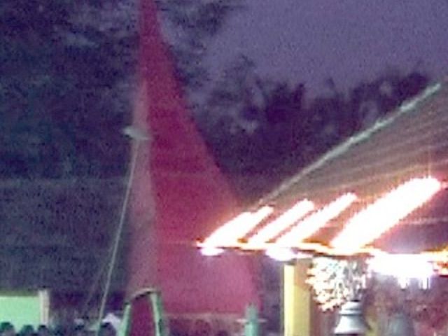 Theyyam: headdress of Bhagavathi: The culmination of Bhagavathi with long and heavy headdress, supported by mushroom shaped poles. Theyyam: headdress of Bhagavathi: The culmination of Bhagavathi with long and heavy headdress, supported by mushroom shaped poles.