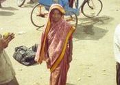 Selling mangos at the bus station by isabel.  Tags: Mandla, Madhya Pradesh, People and Faces, Buses in India, Train Stations, bus.