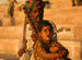 Father and daughter singing by the lake in Pushkar