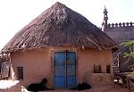 tribal-villags-of-kutch-tribal-hut-and-mosque-red..jpg
